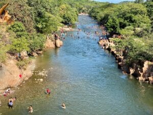Crowded river with people enjoying nature. Valledupar, Colombia.
