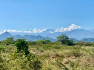 Lush green landscape with distant mountains. Valledupar, Colombia.