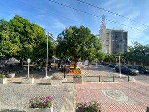 Lively plaza with trees and buildings. Valledupar, Colombia.